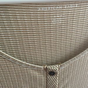 American eagle yellow stripped shirt. Never worn